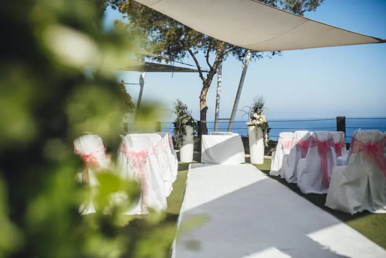 An empty clifftop ceremony aisle set for guests, sea view, Grecian Park Hotel, near Protaras
