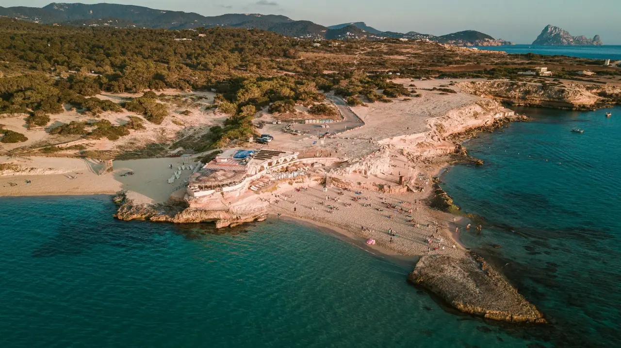 Aerial view over Cala Conta's beaches and turquoise shallows, Ibiza