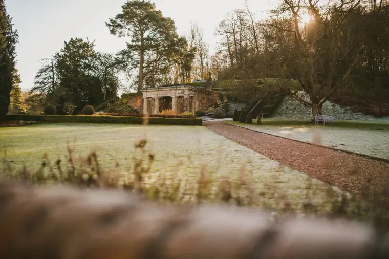 Frosty lawn and formal gardens at Wotton House, Dorking, at sunrise