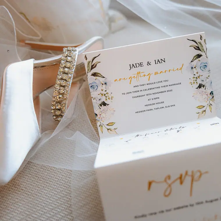 Wedding invitation for Jade and Ian with gold lettering and an RSVP card