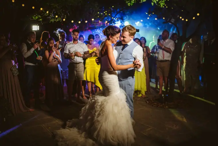 Lauren and Ray's first dance under coloured lights at Aphrodite Hills, Kouklia