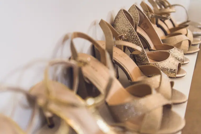 Row of nude and glitter heeled sandals for the bridal party