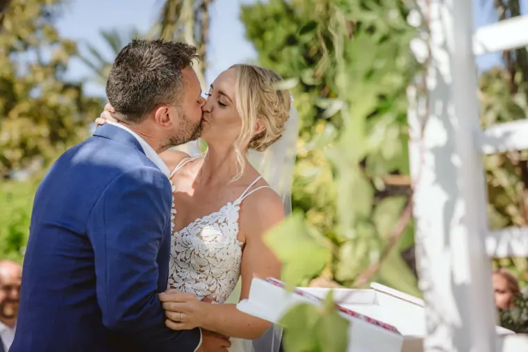Sophie and Iain sharing their first kiss as husband and wife