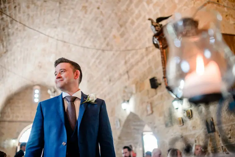 Stephen waiting at the altar inside the stone church of Ayia Kyriaki