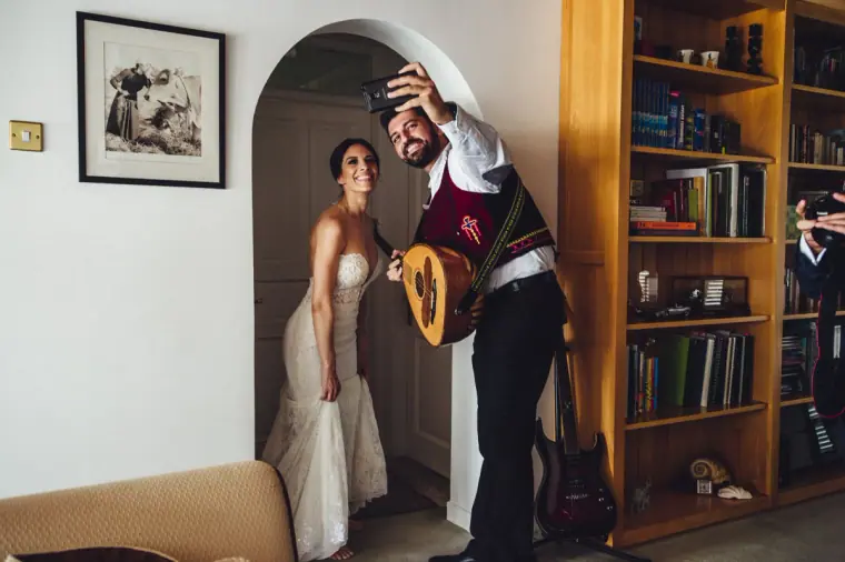 Ruby standing in a doorway as the lute player serenades her