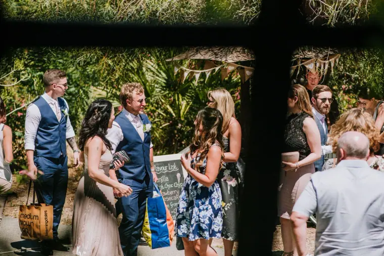 Guests gathering and chatting in the courtyard before the ceremony