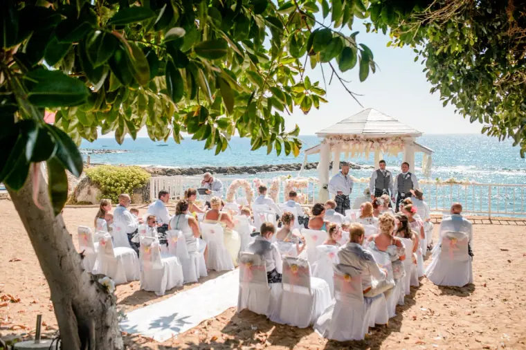 Guests seated before the seaside gazebo awaiting the ceremony at Laura Beach Hotel, Paphos