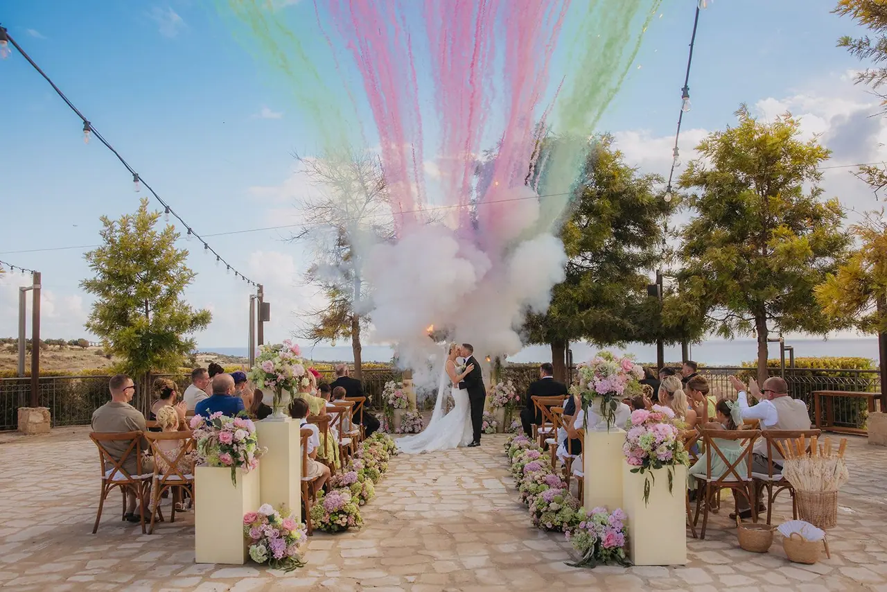 Pink and green smoke bursting over the Liopetro terrace as Zoe and Oliver share their first kiss