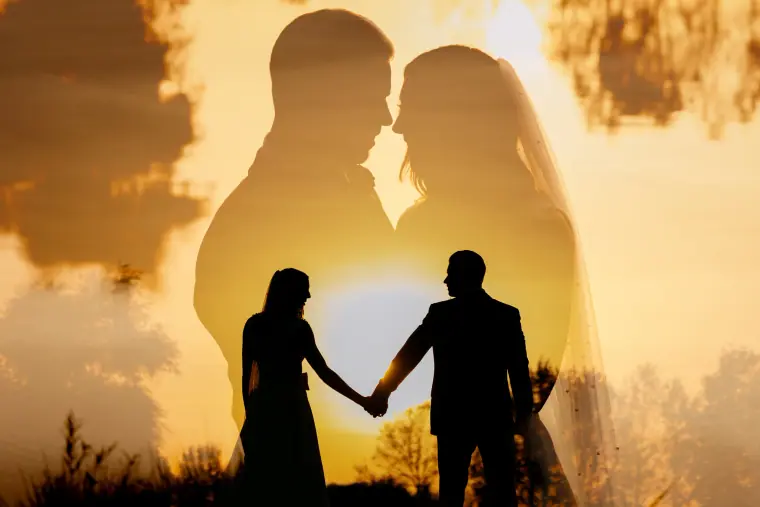 Double-exposure silhouette of a couple holding hands at sunset, Wokefield Park