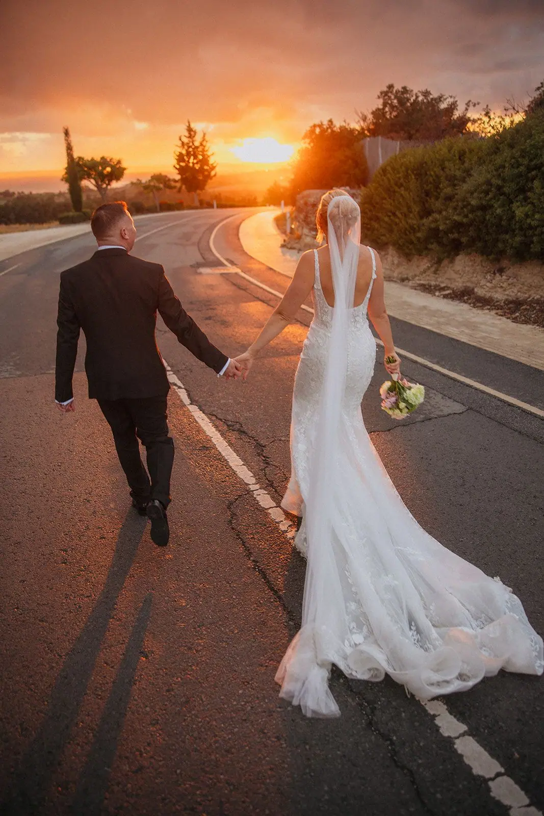 Zoe and Oliver walking into the sunset, their shadows stretching behind them