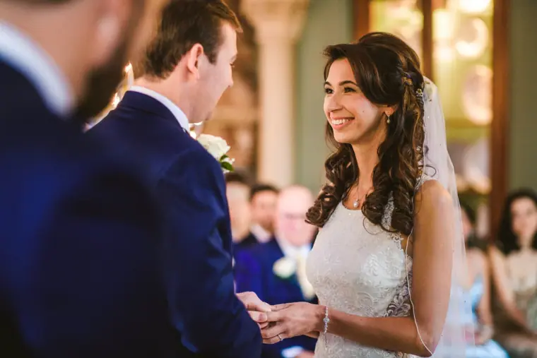 Elina smiling at Iain as they exchange rings