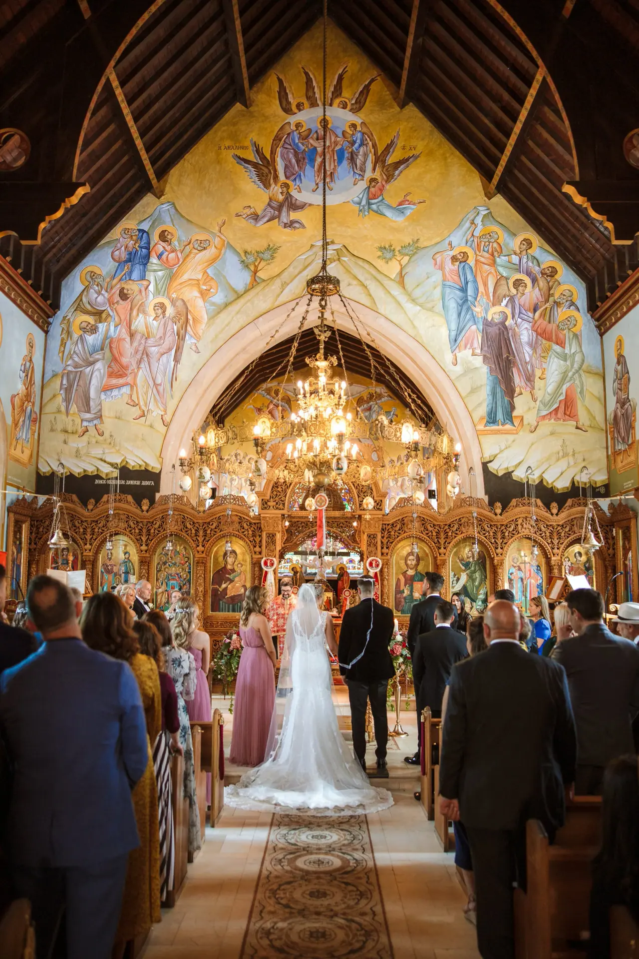 Olivia walking down the aisle of the frescoed church
