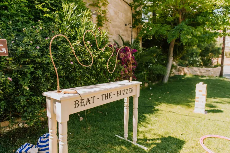 Wooden Beat the Buzzer wire game set up on the lawn