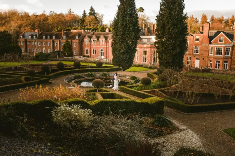 Wotton House's red-brick facade and formal knot garden in autumn colour, Dorking