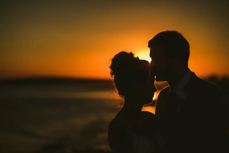 Naomi and Dale silhouetted nose to nose against a glowing sunset, Nissi Beach, Ayia Napa