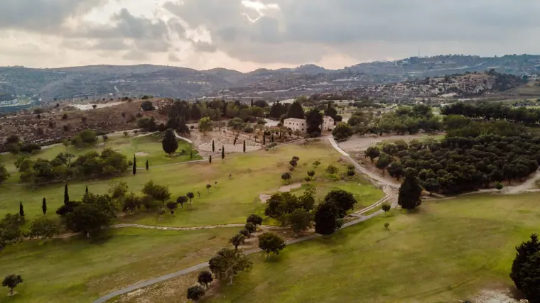 Aerial view of Minthis Hills golf course and the hills beyond Tsada