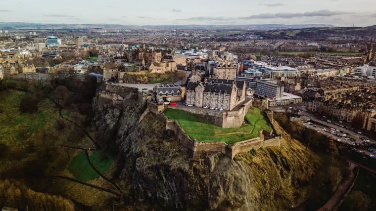 Aerial view of Edinburgh Castle on its rocky crag above the city skyline