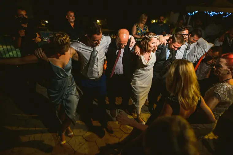 Guests dancing in a crowd on the dance floor at night