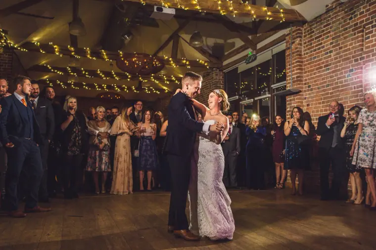 Charlie spinning Sarah during their first dance in the brick barn
