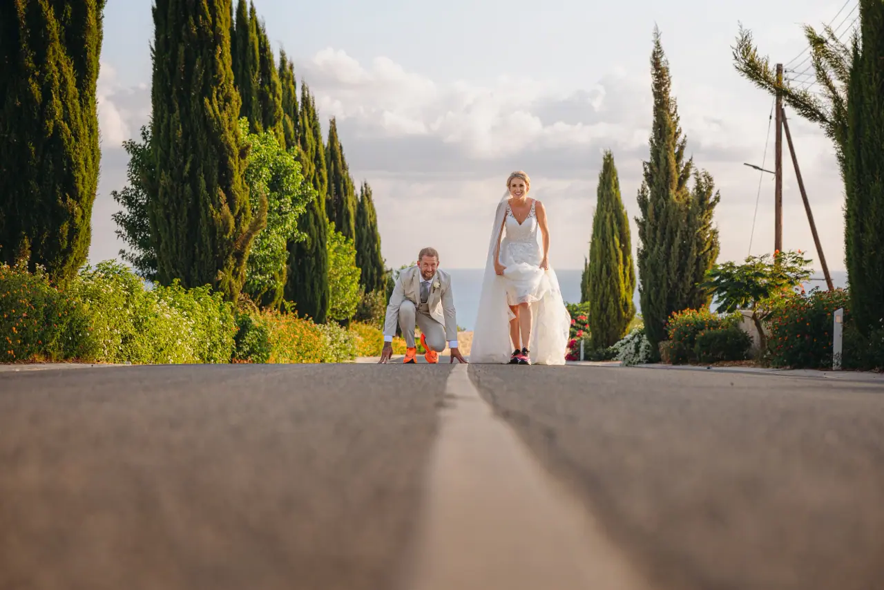 Katie and James on a quiet road lined with cypress trees near Liopetro