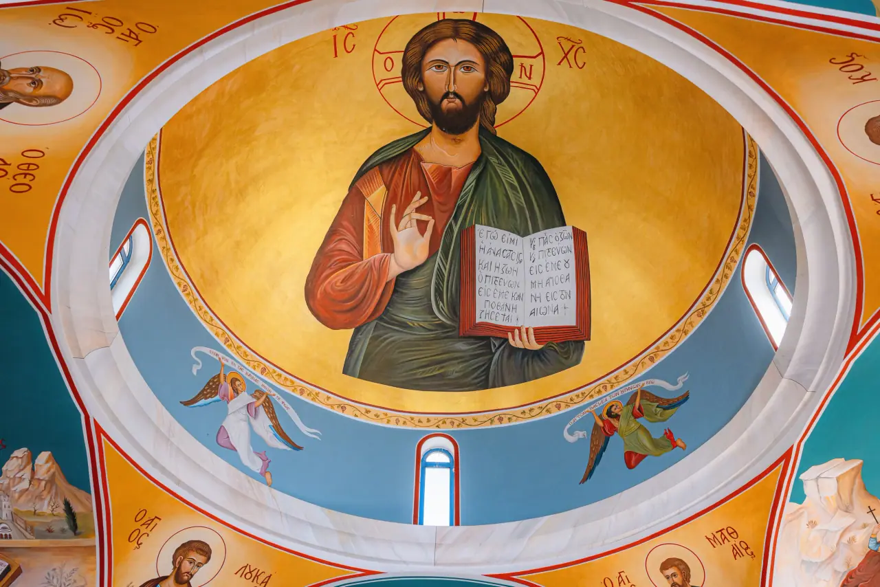 Painted dome of Christ Pantocrator inside an Orthodox church at Lagi and Annika's wedding